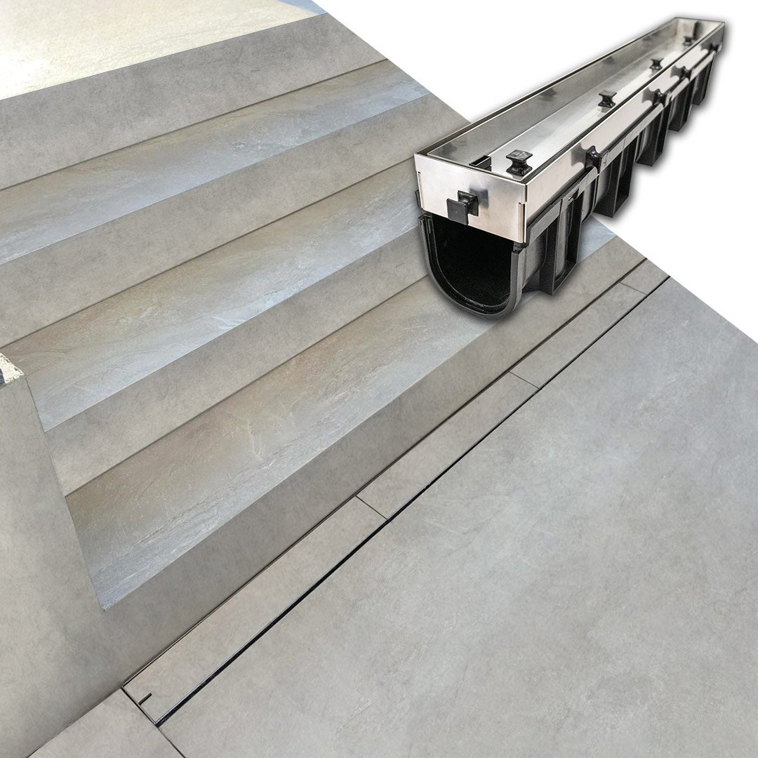 HIDE stainless steel Concrete Linear Strip Drain Cover installed under stairs.