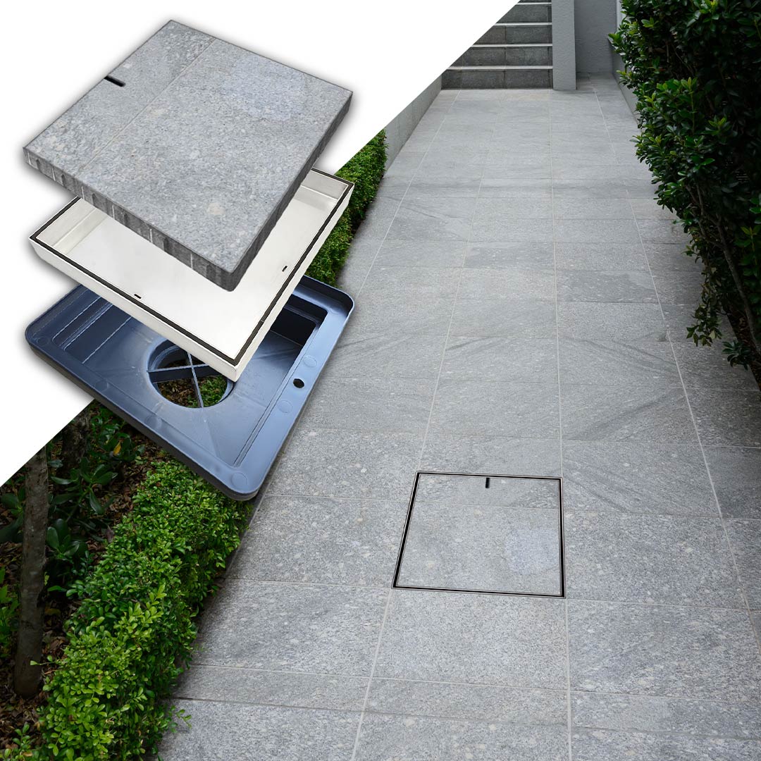 HIDE Drain Cover with grey tile inlay installed along house walkway