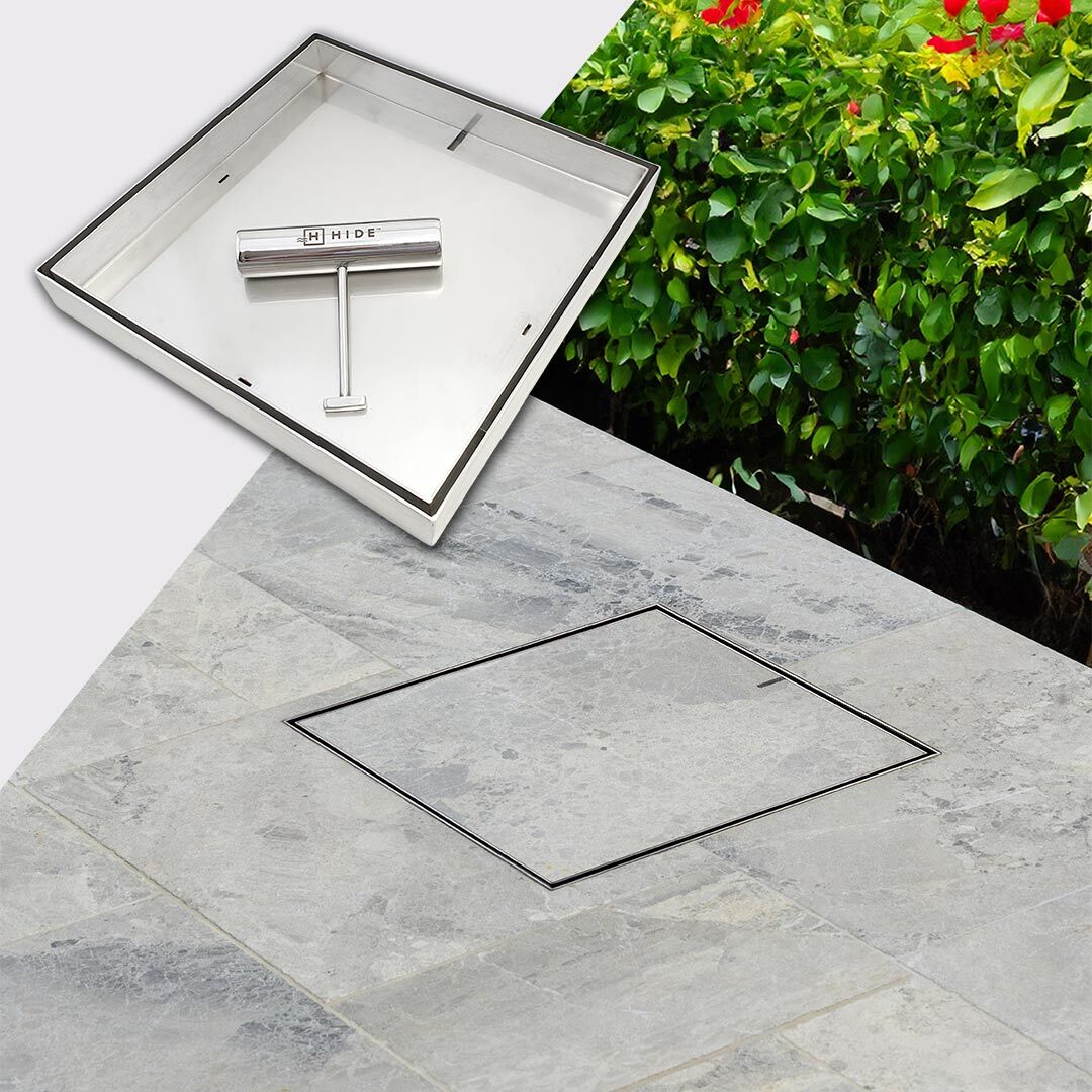 HIDE Drain Cover with grey tile inlay installed flush to surrounding tile.