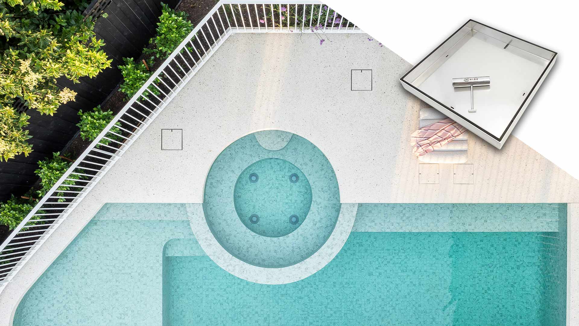 HIDE Concrete Drain Covers installed next to modern curved swimming pool